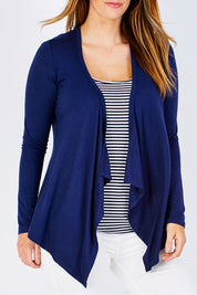 Model Laura wearing size 12 of the Melbourne Stretch Cardigan in colour Navy (Blue), from the front, cropped image