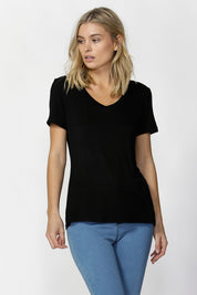 A model wearing the Manhattan Stretch Tee in colour Black (Black), from the front, cropped image
