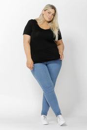 A model wearing the Manhattan Stretch Tee in colour Black (Black), from the front, showing the whole outfit