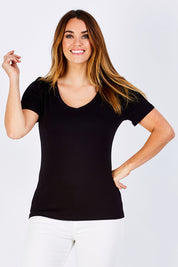 Model Laura wearing size 12 of the Manhattan Stretch Tee in colour Black (Black), from the front, cropped image