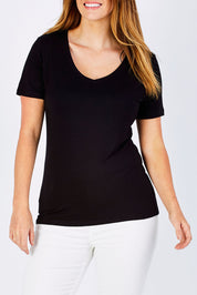 Model Laura wearing size 12 of the Manhattan Stretch Tee in colour Black (Black), from the front, cropped image
