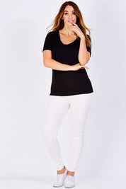 Model Laura wearing size 12 of the Manhattan Stretch Tee in colour Black (Black), from the front, showing the whole outfit