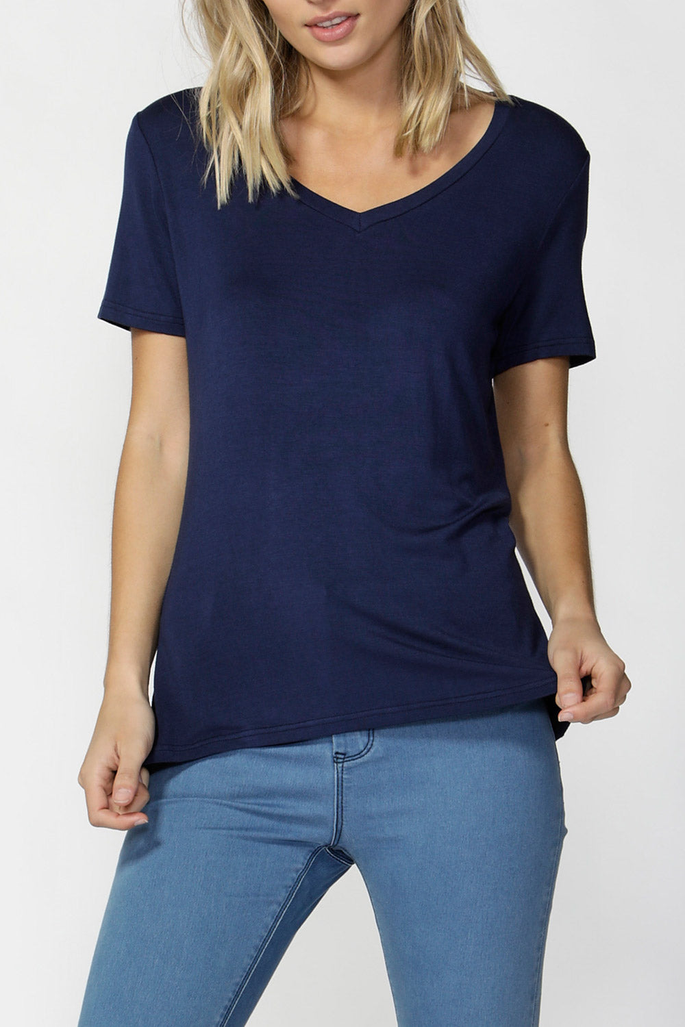 A model wearing the Manhattan Stretch Tee in colour Navy (Blue), from the front, cropped image