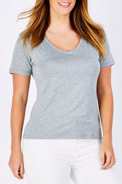 Model Laura wearing size 12 of the Manhattan Stretch Tee in colour SilverMarl (Grey), from the front, cropped image