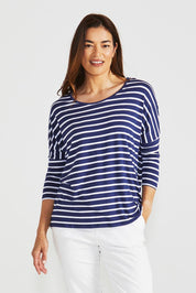 A model wearing the Milan 3/4 Sleeve Top in colour Paristripe (Blue), from the front, cropped image