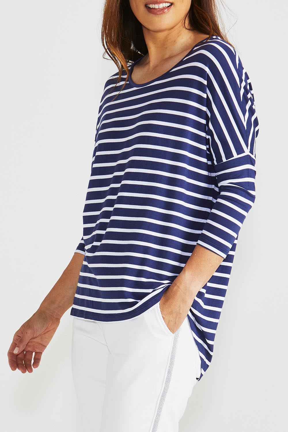 A model wearing the Milan 3/4 Sleeve Top in colour Paristripe (Blue), from the front, cropped image