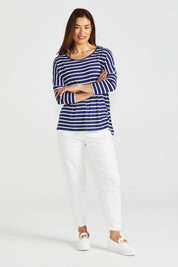 A model wearing the Milan 3/4 Sleeve Top in colour Paristripe (Blue), from the front, showing the whole outfit