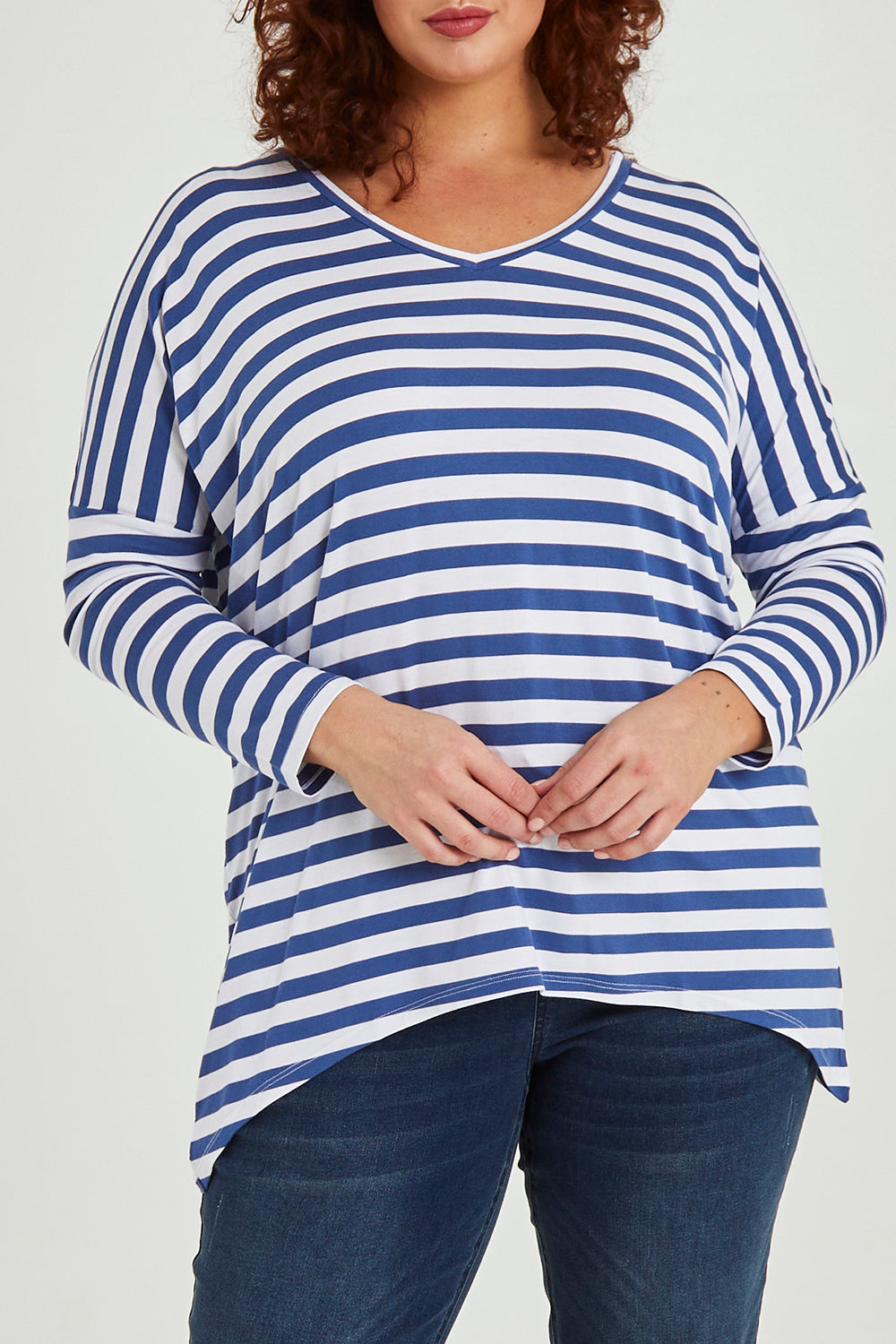 Model Maddy wearing size 16 of the Geneva Tee in colour Whitestrip (White), from the front, cropped image