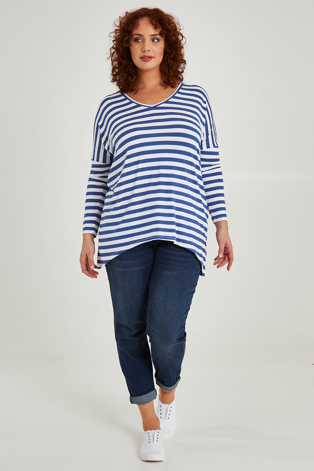Model Maddy wearing size 16 of the Geneva Tee in colour Whitestrip (White), from the front, showing the whole outfit