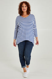 Model Maddy wearing size 16 of the Geneva Tee in colour Whitestrip (White), from the front, showing the whole outfit