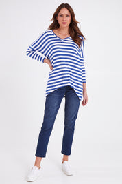 Model Madeline wearing size 10 of the Geneva Tee in colour Whitestrip (White), from the front, showing the whole outfit