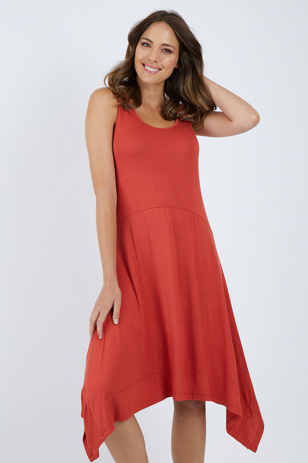 Model Madeline wearing size 10 of the Madrid Dress in colour Sunset, from the front, cropped image