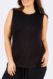 Model Tia wearing size 14 of the Capri Tank in colour Black (Black), from the front, cropped image
