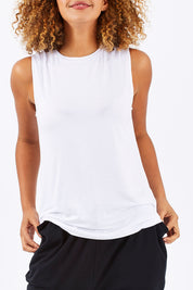 Model Summer wearing size 10 of the Capri Tank in colour White (White), from the front, cropped image