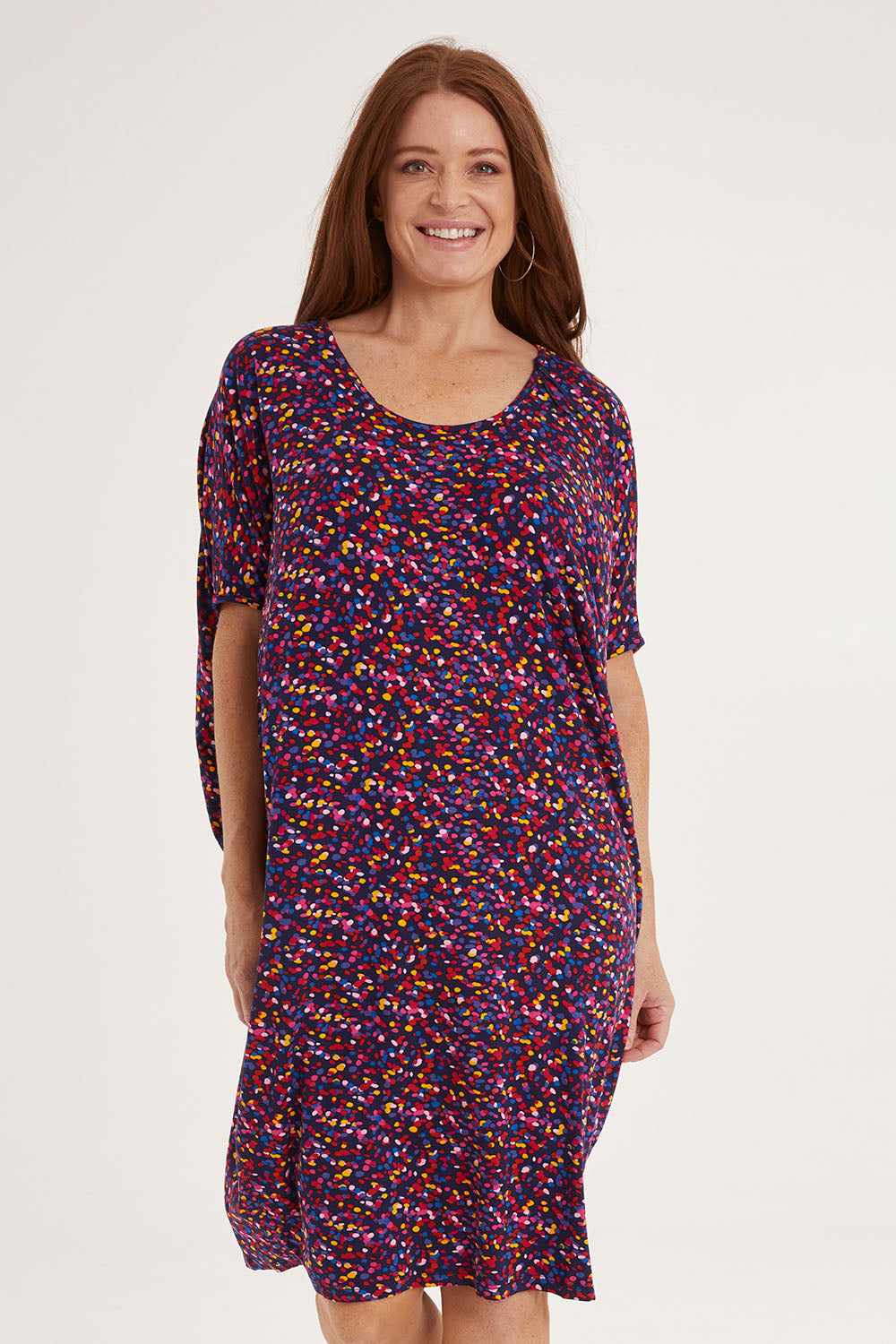 Model Sally wearing size 10 of the Maui Dress in colour Confetti (Blue), from the front, cropped image