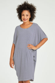 Model Olivia wearing size 10 of the Maui Dress in colour Navywhite (Blue), from the front, cropped image