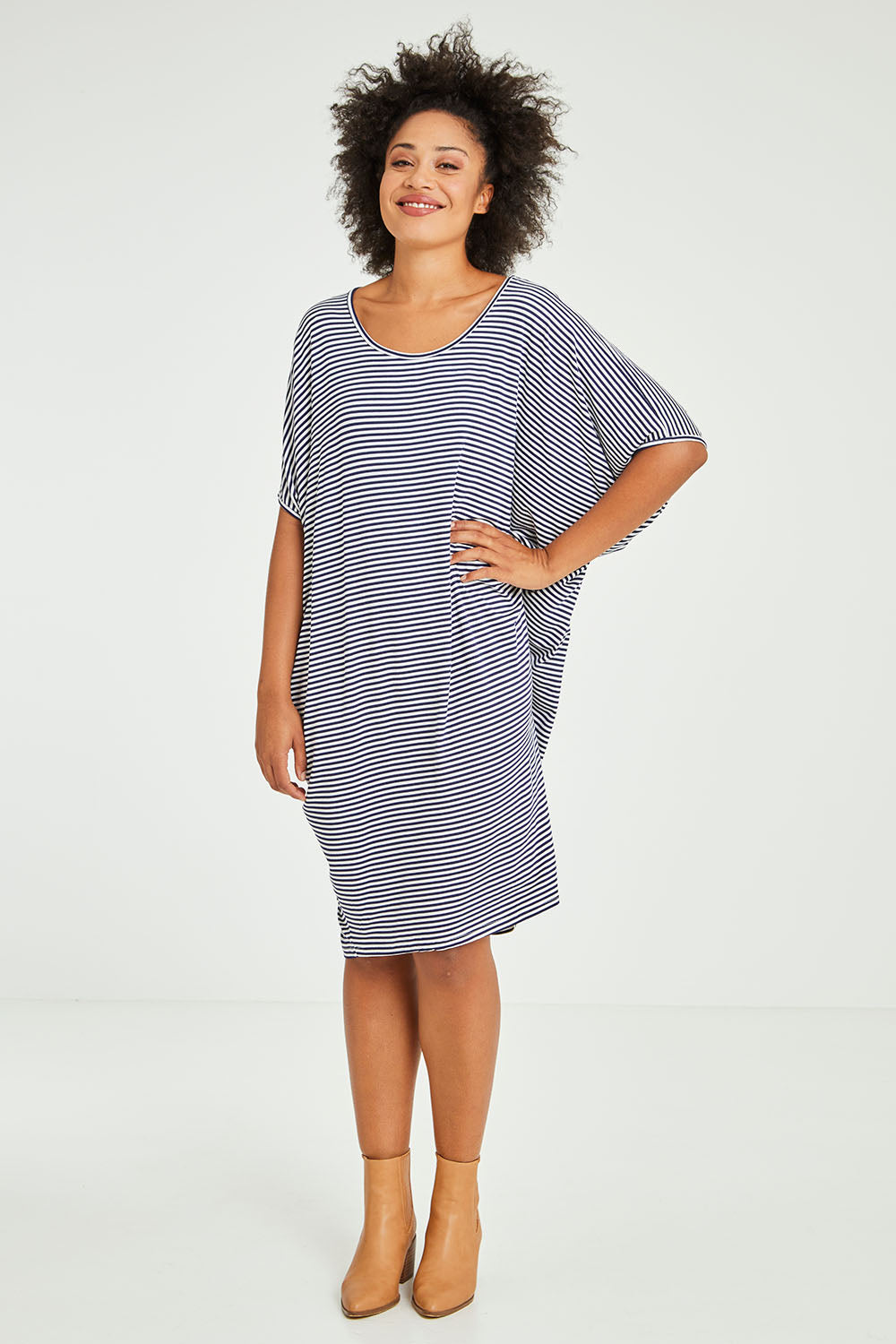 Model Olivia wearing size 10 of the Maui Dress in colour Navywhite (Blue), from the front, showing the whole outfit
