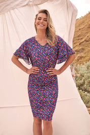 A model wearing the Ripon Top in colour Confetti (Blue), from the front, showing the whole outfit