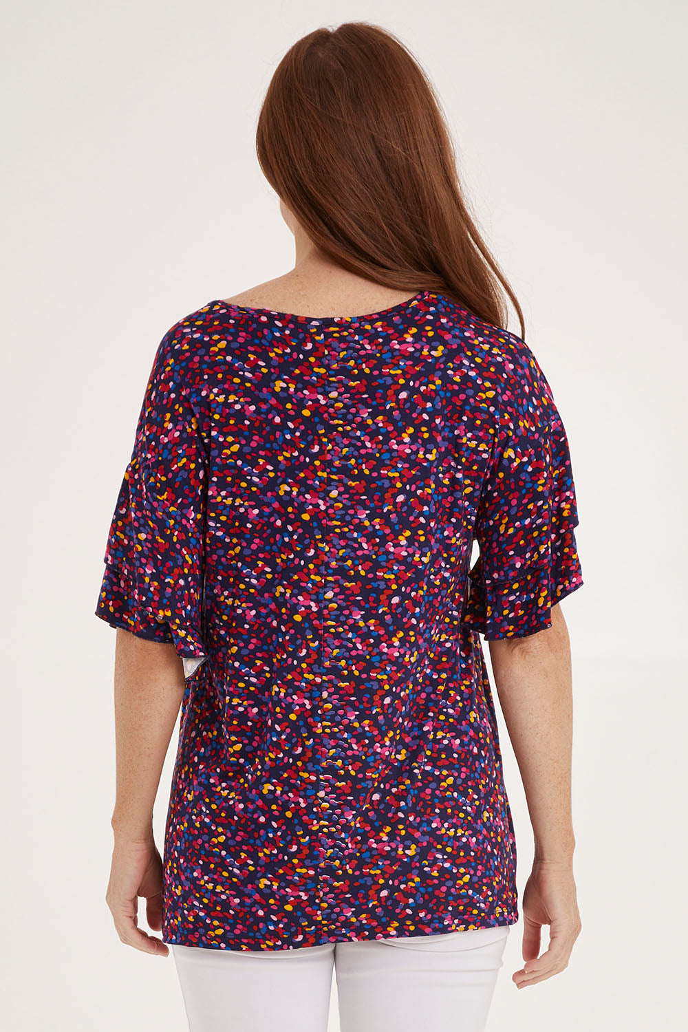 Model Sally wearing size 10 of the Ripon Top in colour Confetti (Blue), from the back