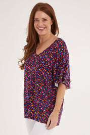 Model Sally wearing size 10 of the Ripon Top in colour Confetti (Blue), from the front, cropped image