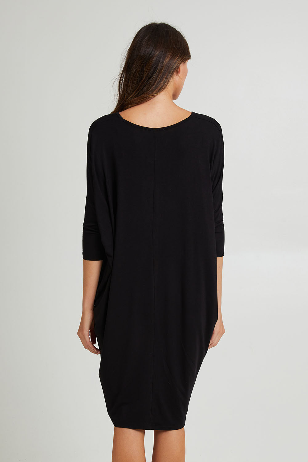 Model Madeline wearing size 10 of the Lucia Dress in colour Black (Black), from the back