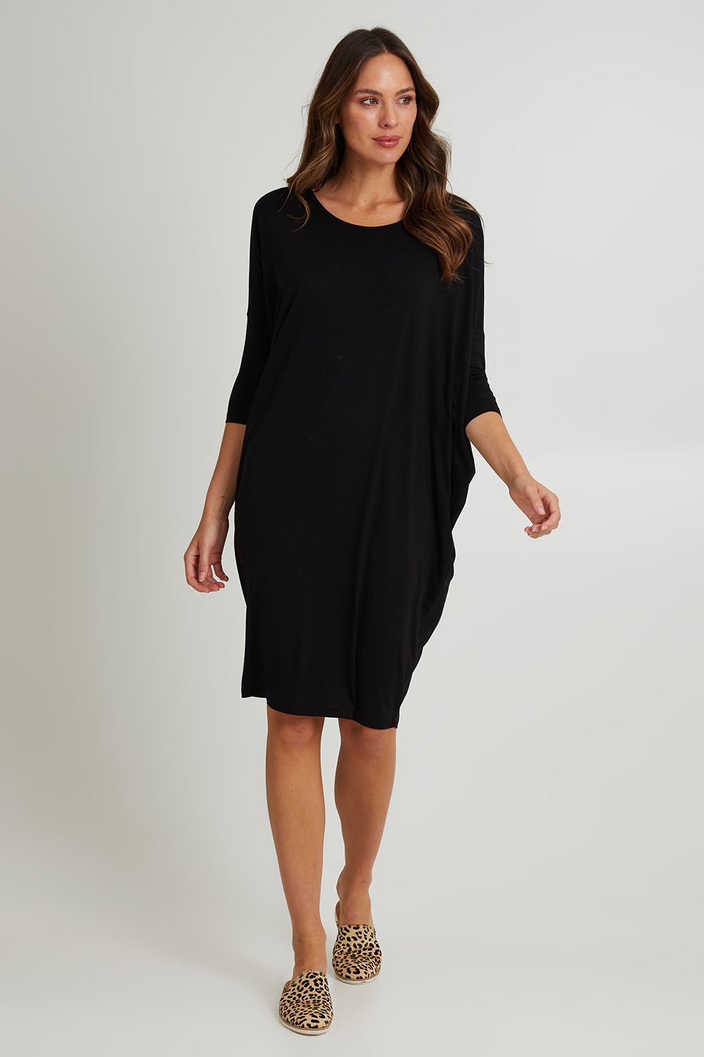 Model Madeline wearing size 10 of the Lucia Dress in colour Black (Black), from the front, showing the whole outfit