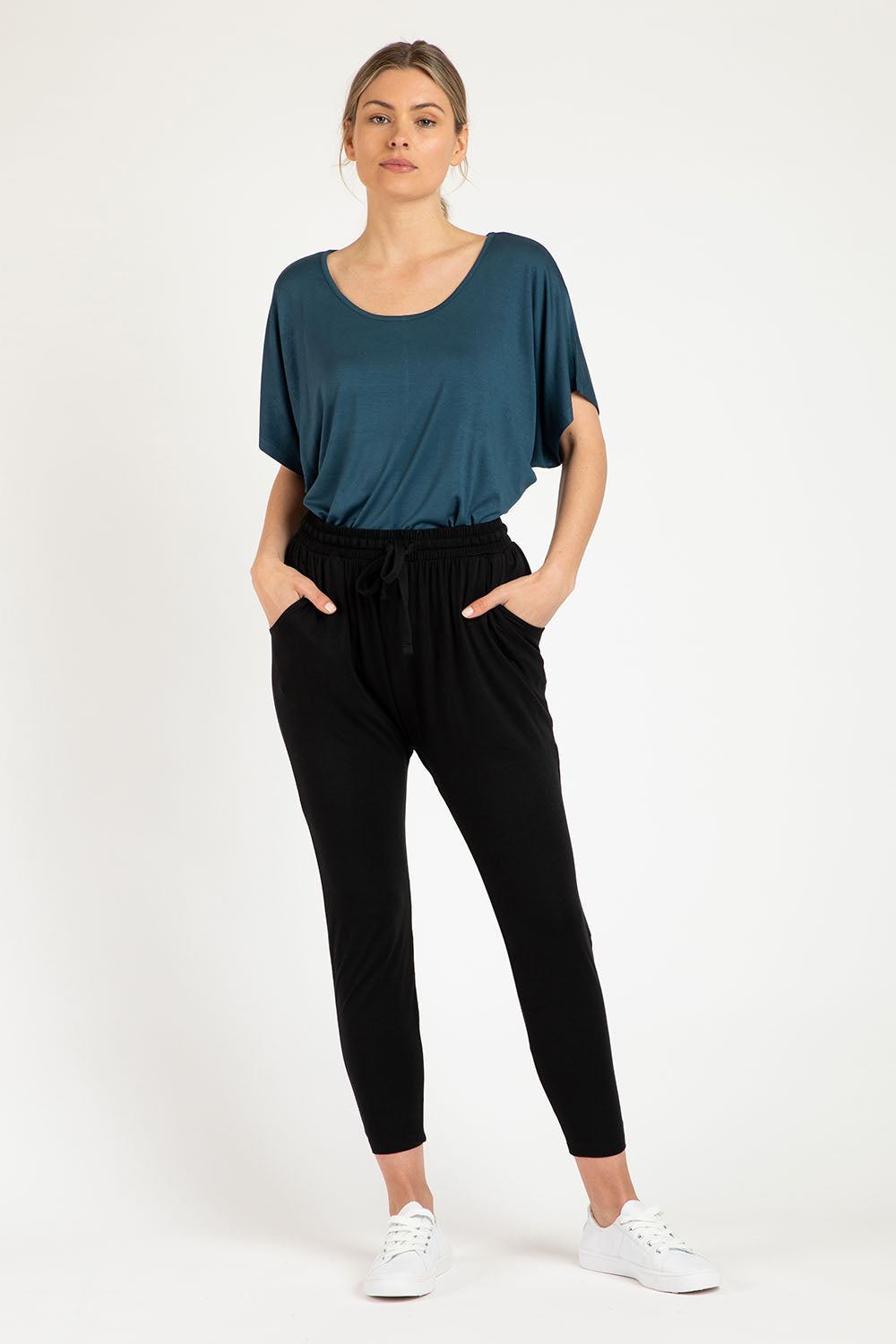 A model wearing the Hamilton Pant in colour Black (Black), from the front, showing the whole outfit