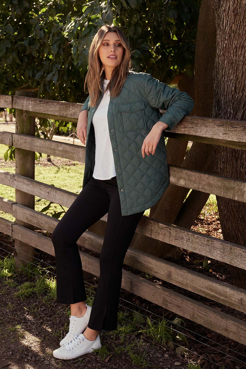 A model wearing the Pasadena Quilted Shacket in colour Silverfern (Green), from the front, showing the whole outfit