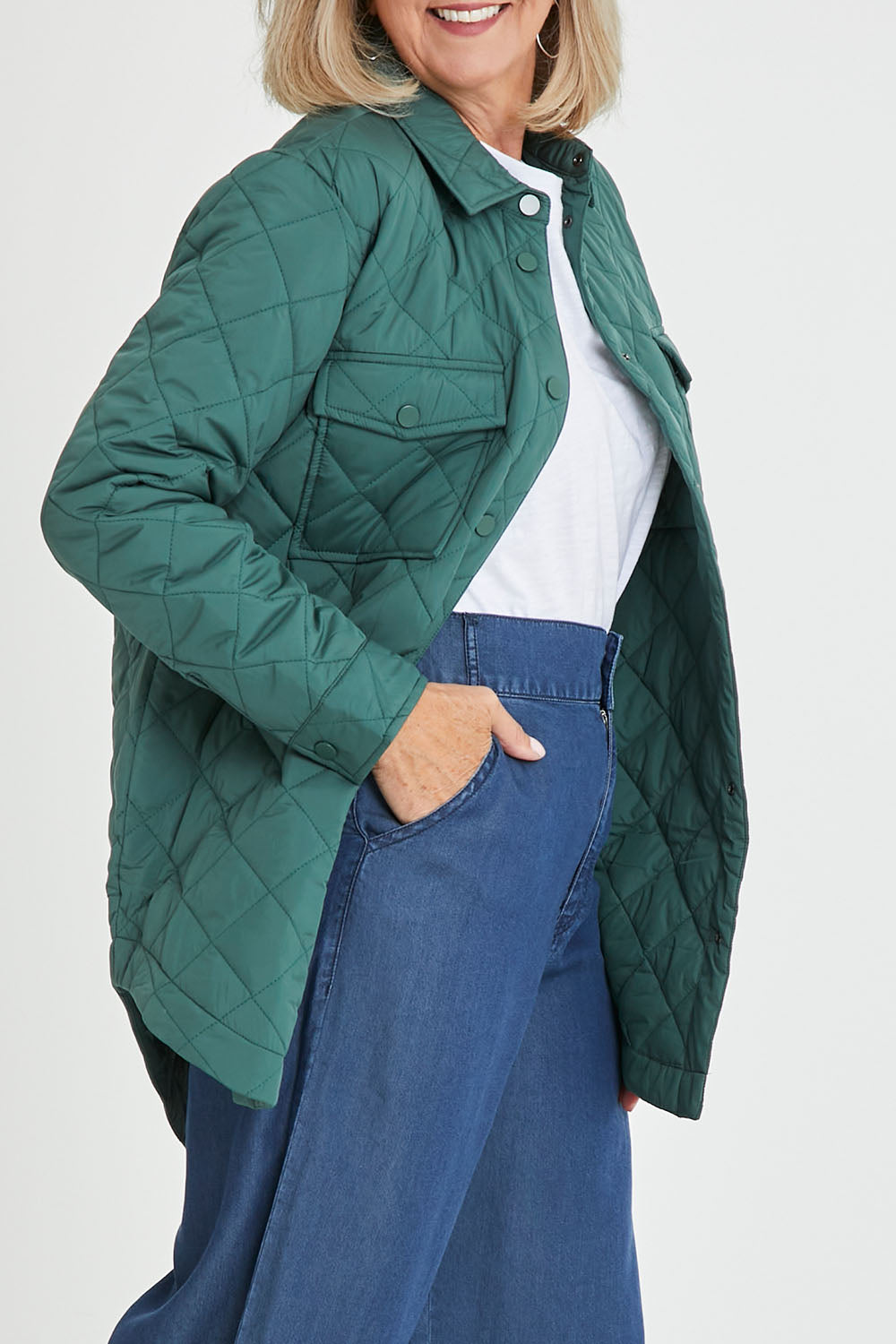 Model Sandy wearing size S of the Pasadena Quilted Shacket in colour Silverfern (Green), from the front, cropped image