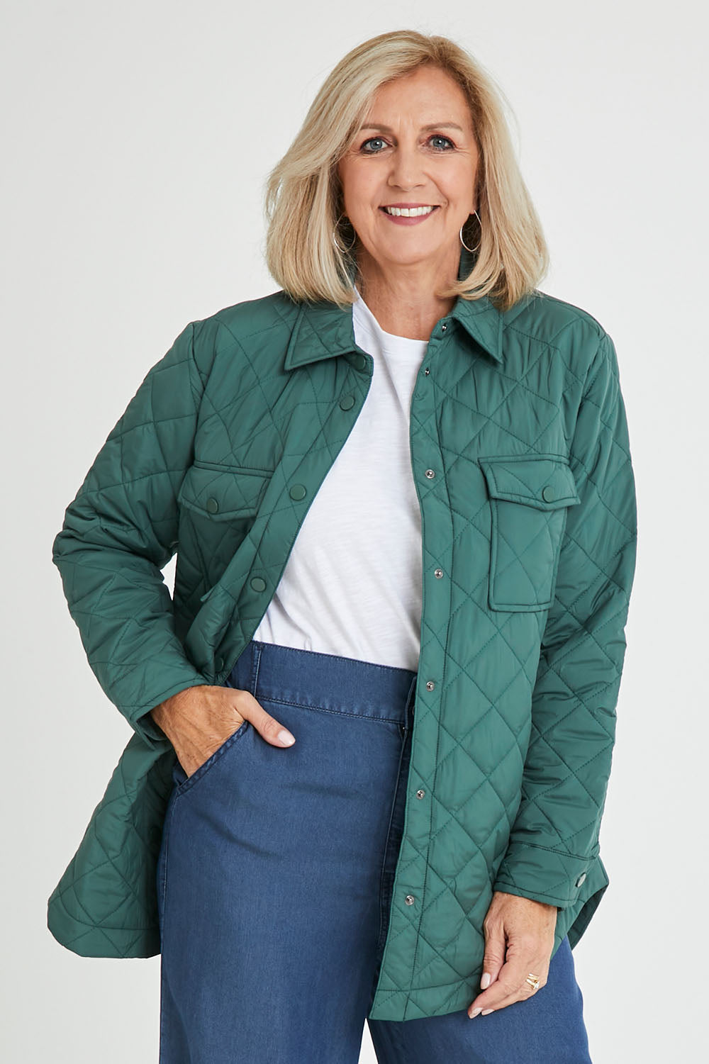 Model Sandy wearing size S of the Pasadena Quilted Shacket in colour Silverfern (Green), from the front, cropped image