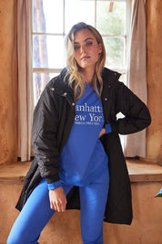 A model wearing the Tribeca Puffer Jacket in colour Black (Black), from the front, showing the whole outfit