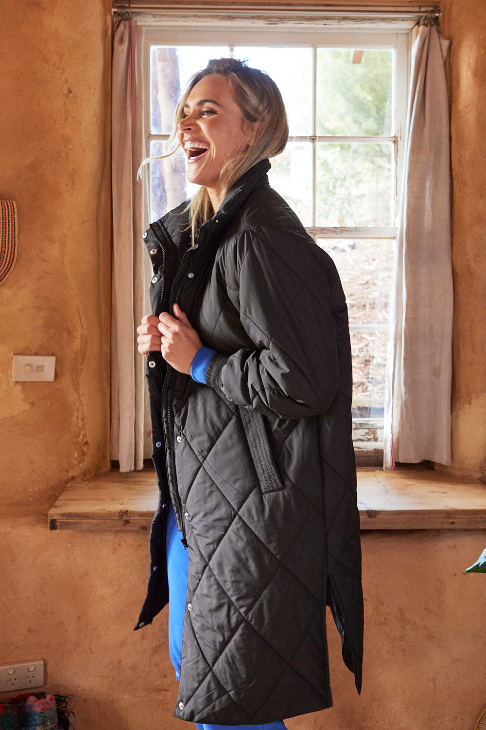 A model wearing the Tribeca Puffer Jacket in colour Black (Black), from the front, showing the whole outfit