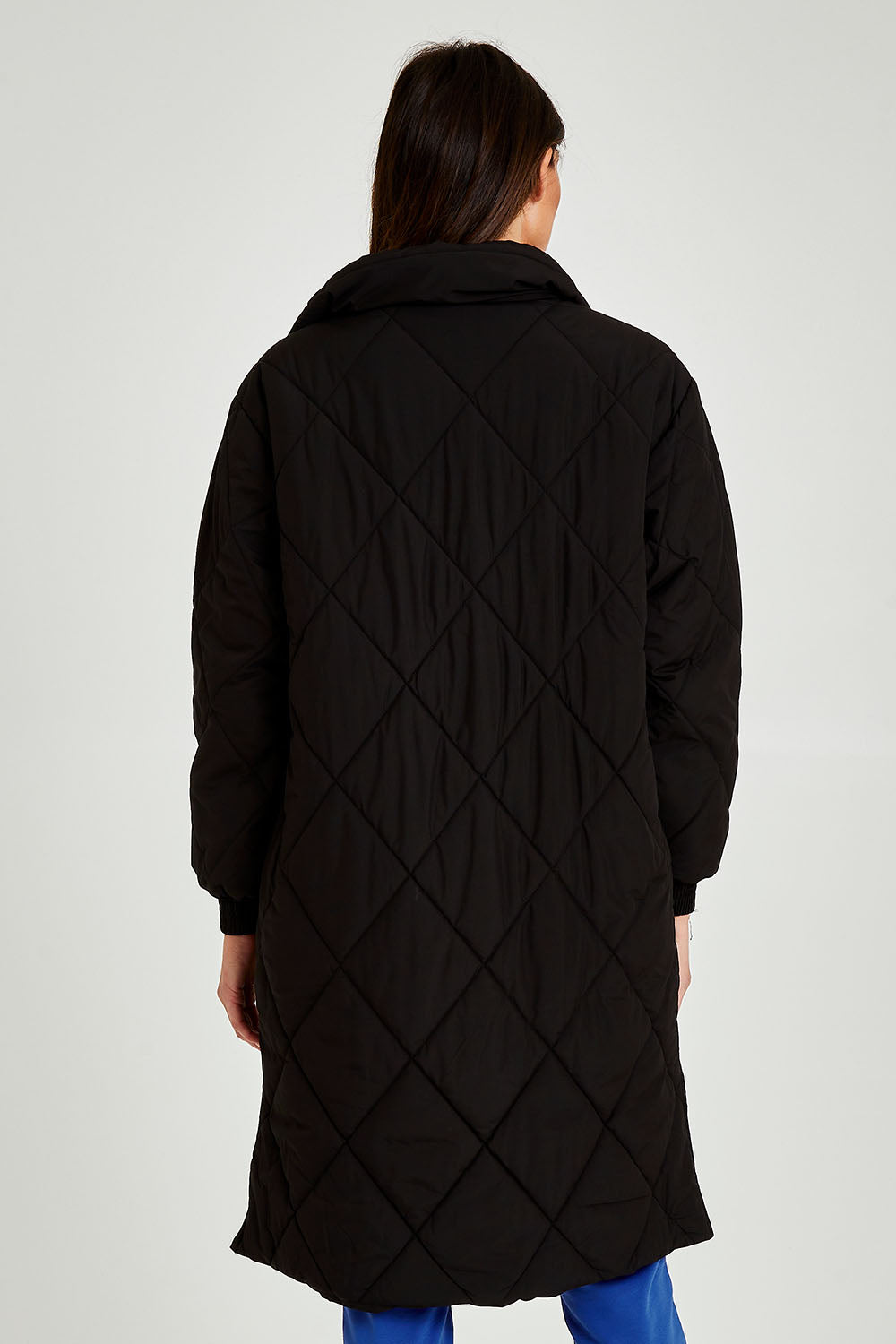 Model Madeline wearing size 10 of the Tribeca Puffer Jacket in colour Black (Black), from the back
