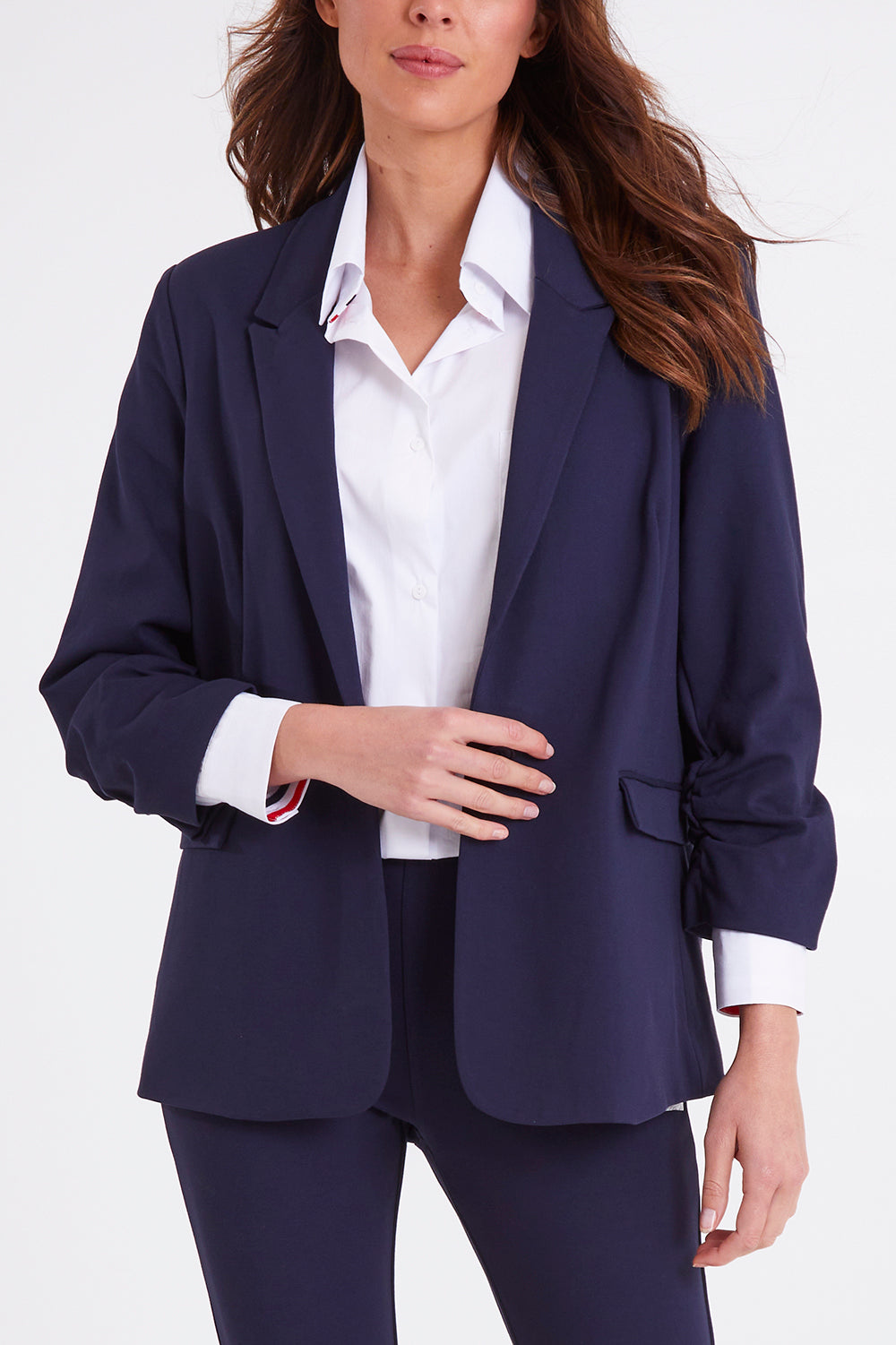 Model Madeline wearing size 10 of the Merci Ponte Blazer in colour Peonynavy (Blue), from the front, cropped image