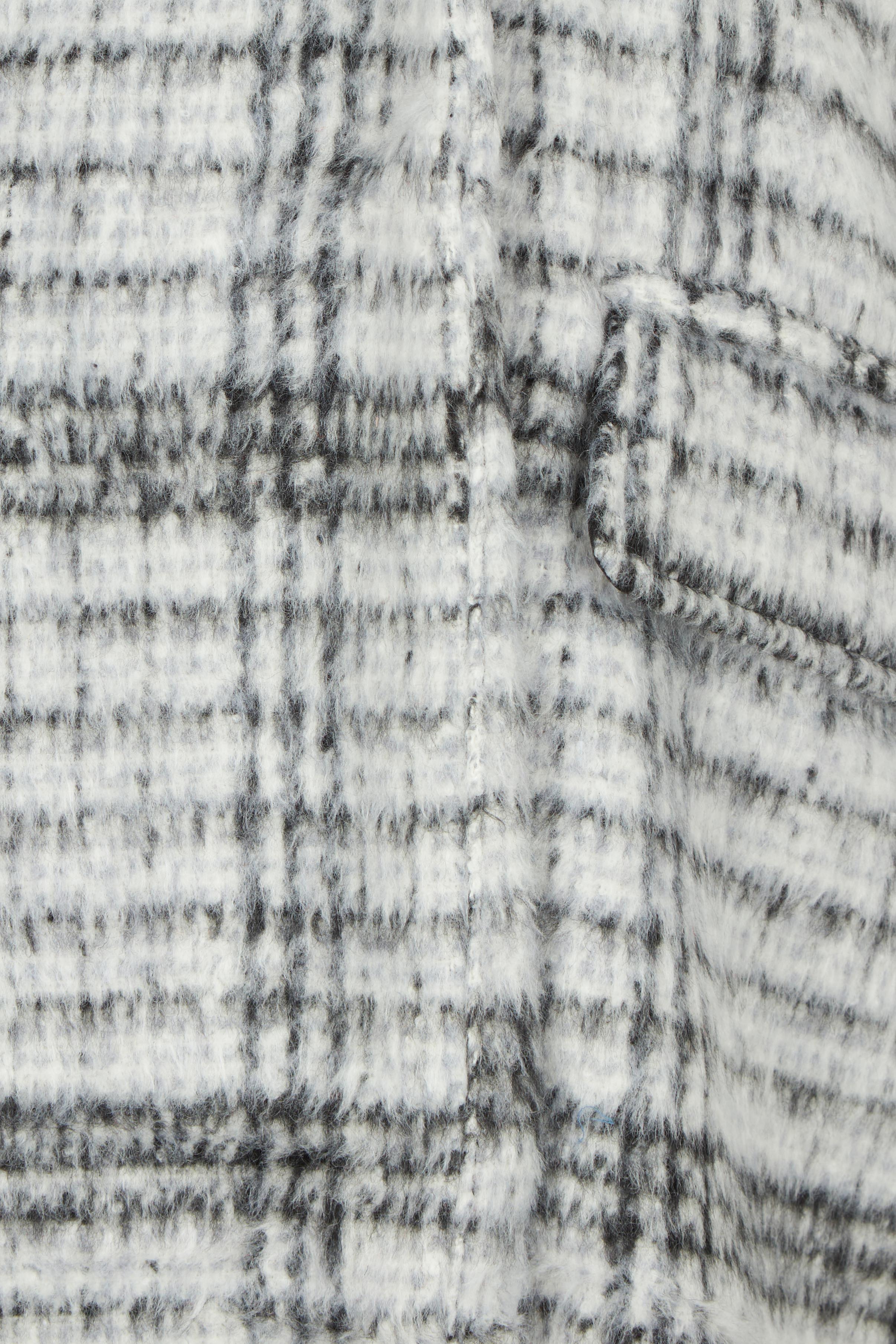 Product shot of the Wanda Coat in colour Monochrome (Grey), detail