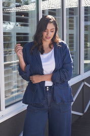 A model wearing the Melba Denim Blazer in colour Drkrinse (Blue), from the front, showing the whole outfit