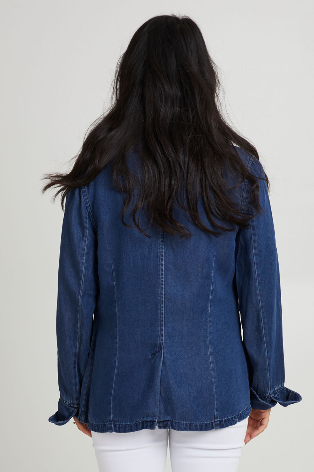 Model Katie wearing size 10 of the Melba Denim Blazer in colour Drkrinse (Blue), from the back