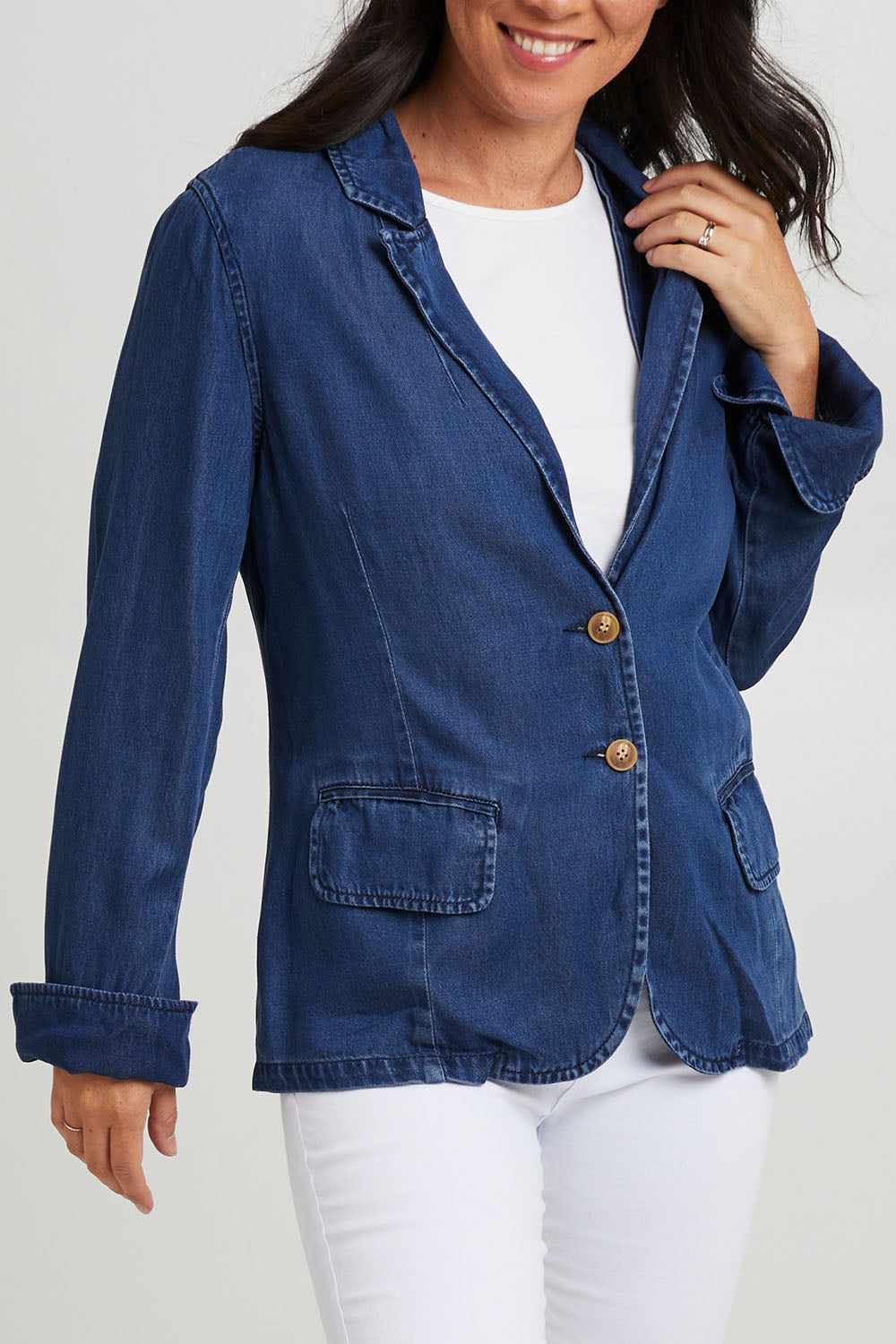 Model Katie wearing size 10 of the Melba Denim Blazer in colour Drkrinse (Blue), from the front, cropped image