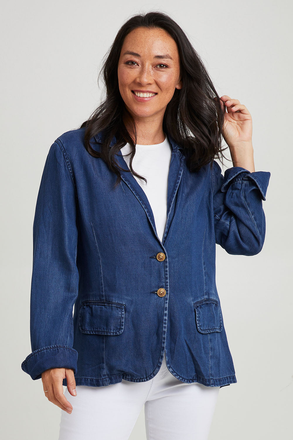 Model Katie wearing size 10 of the Melba Denim Blazer in colour Drkrinse (Blue), from the front, cropped image