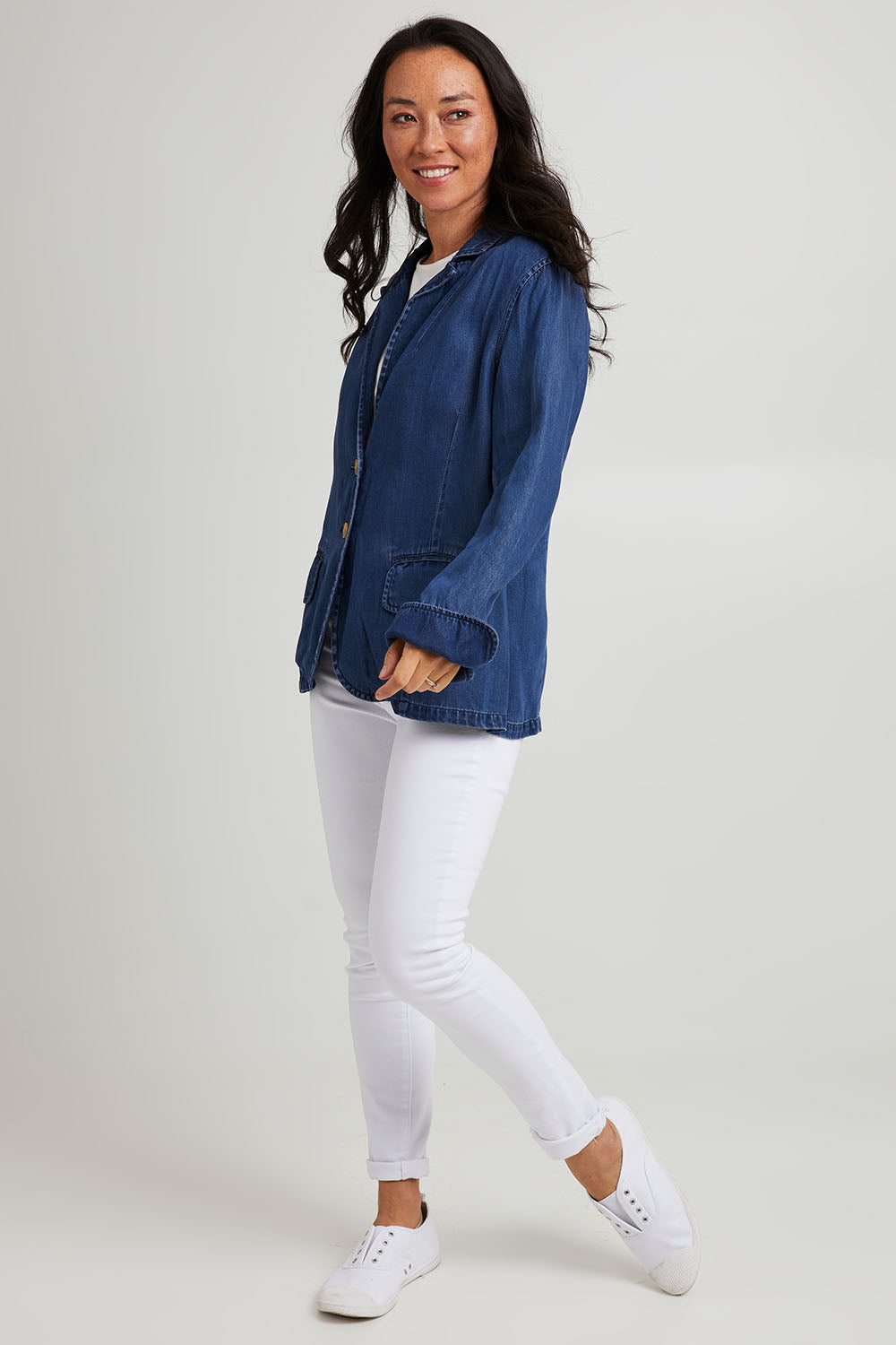 Model Katie wearing size 10 of the Melba Denim Blazer in colour Drkrinse (Blue), from the front, showing the whole outfit