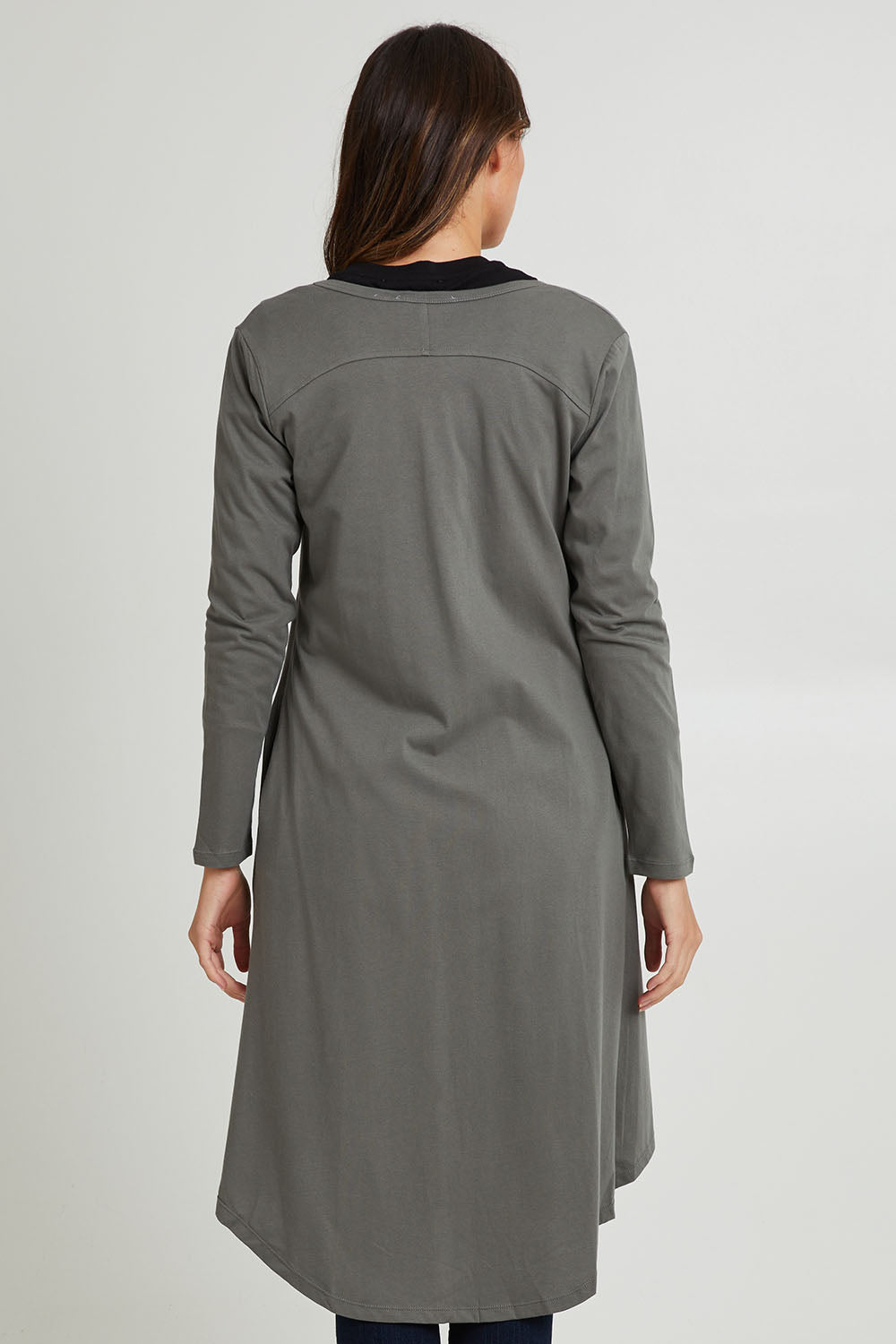 Model Madeline wearing size 10 of the Byron Cardigan in colour Ashgreen, from the back