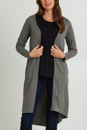 Model Madeline wearing size 10 of the Byron Cardigan in colour Ashgreen, from the front, cropped image
