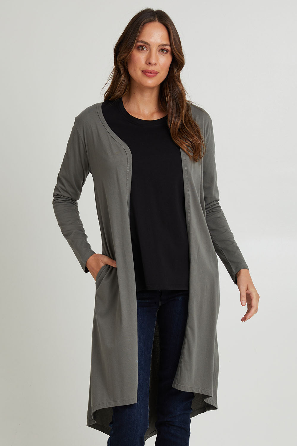 Model Madeline wearing size 10 of the Byron Cardigan in colour Ashgreen, from the front, cropped image