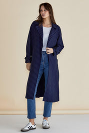 A model wearing the Mayla Duster in colour Bluepinstr (Blue), from the front, showing the whole outfit