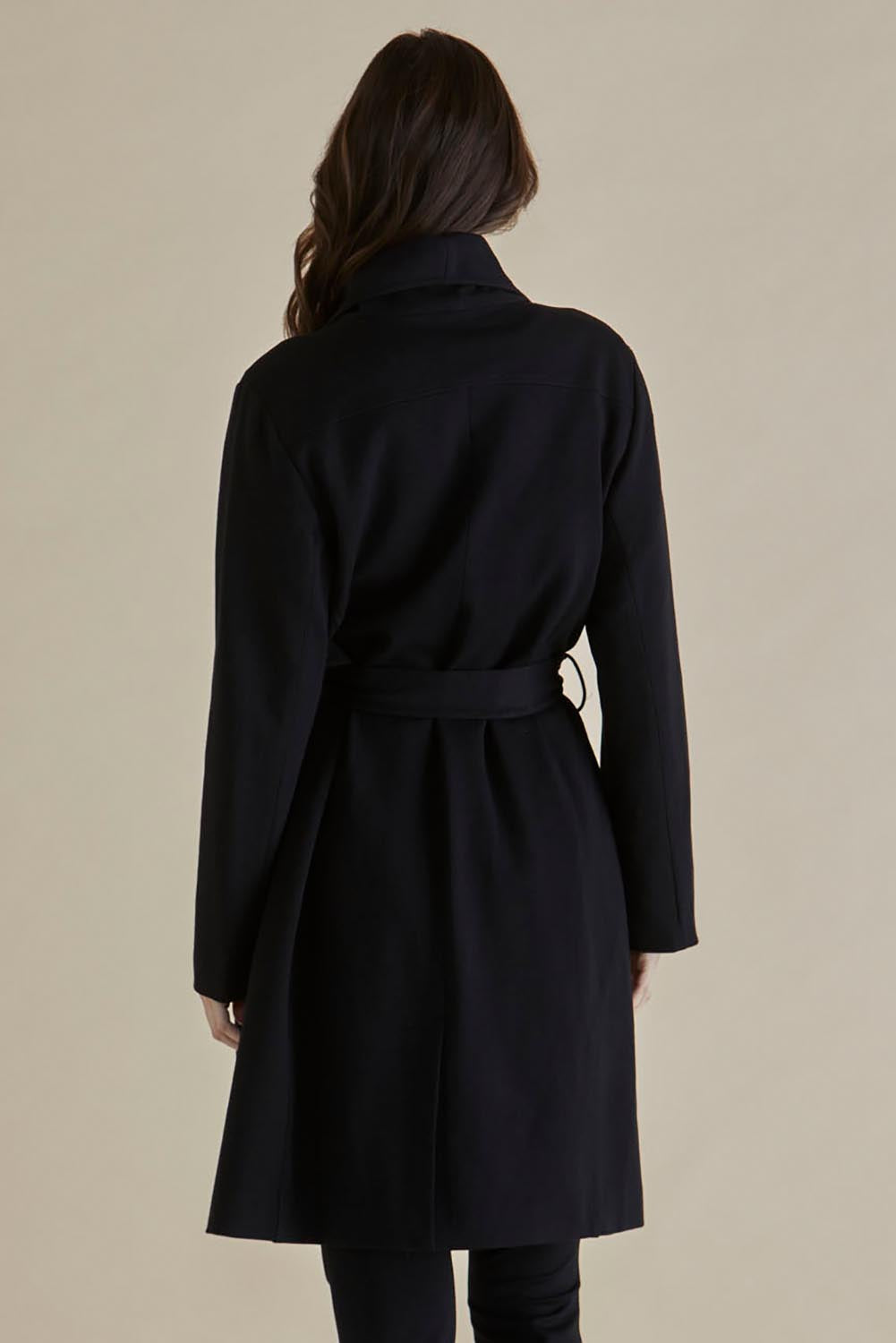 A model wearing the Gabriel Coat in colour Black (Black), from the back