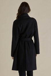 A model wearing the Gabriel Coat in colour Black (Black), from the back