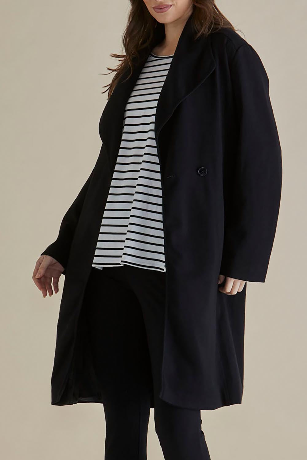 A model wearing the Gabriel Coat in colour Black (Black), from the front, cropped image