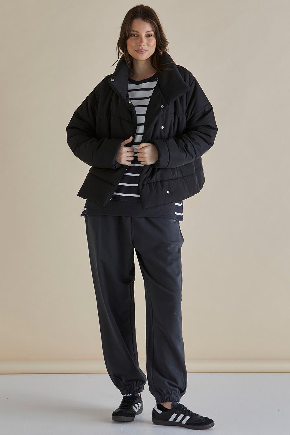 A model wearing the Presley Puffer Jacket in colour Black (Black), from the front, showing the whole outfit