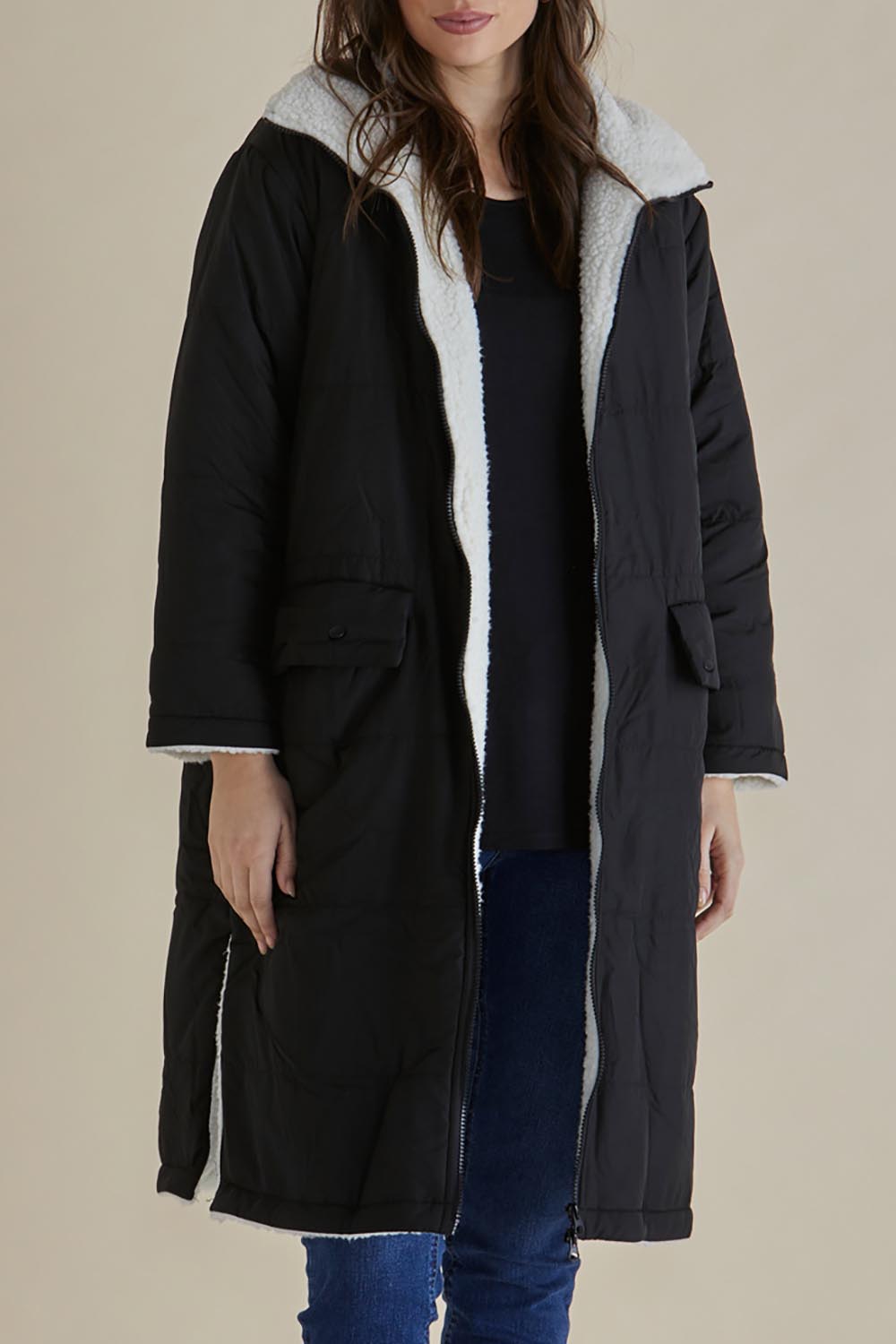 A model wearing the Valkyrie Puffer Jacket in colour Black (Black), from the front, cropped image