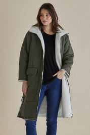 A model wearing the Valkyrie Puffer Jacket in colour Darkgreen (Green), from the front, cropped image